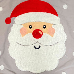 Detalle de rostro de Santa Claus en cojín decorativo