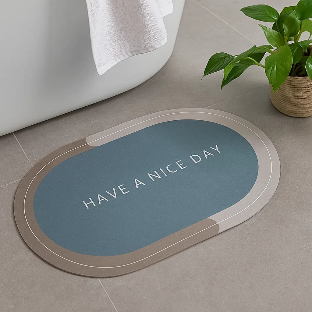 Tapete de baño ovalado 40×60 cm gris “HAVE A NICE DAY” vista frontal