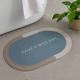 Tapete de baño ovalado 40×60 cm gris “HAVE A NICE DAY” vista frontal