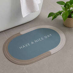 Tapete de baño ovalado 40×60 cm gris “HAVE A NICE DAY” vista frontal