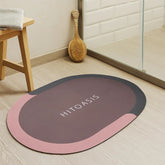 Tapete de baño ovalado 40×60 cm vinotinto “HITOASIS” vista frontal