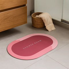 Tapete de baño ovalado 40×60 cm rosa “SHOWER ROOM” vista frontal