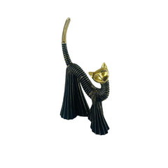 Gato decorativo negro con cabeza y cola dorada en posición de estiramiento