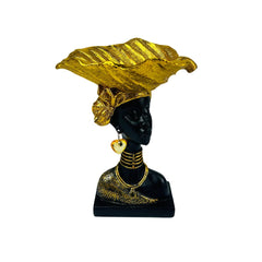 Figura africana decorativa con bandeja dorada