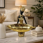 Figura decorativa mujer africana con bandeja dorada en forma de hoja