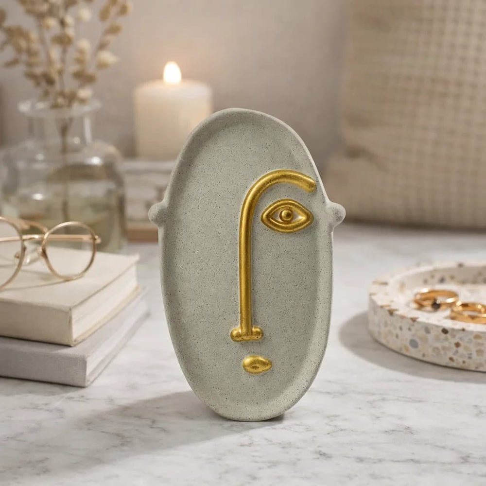Figura decorativa rostro abstracto beige con detalle dorado