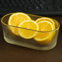 Recipiente de vidrio transparente con diseño de líneas y borde dorado