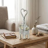 Pareja de elefantes blanco y dorado 30×10 cm con trompas formando corazón