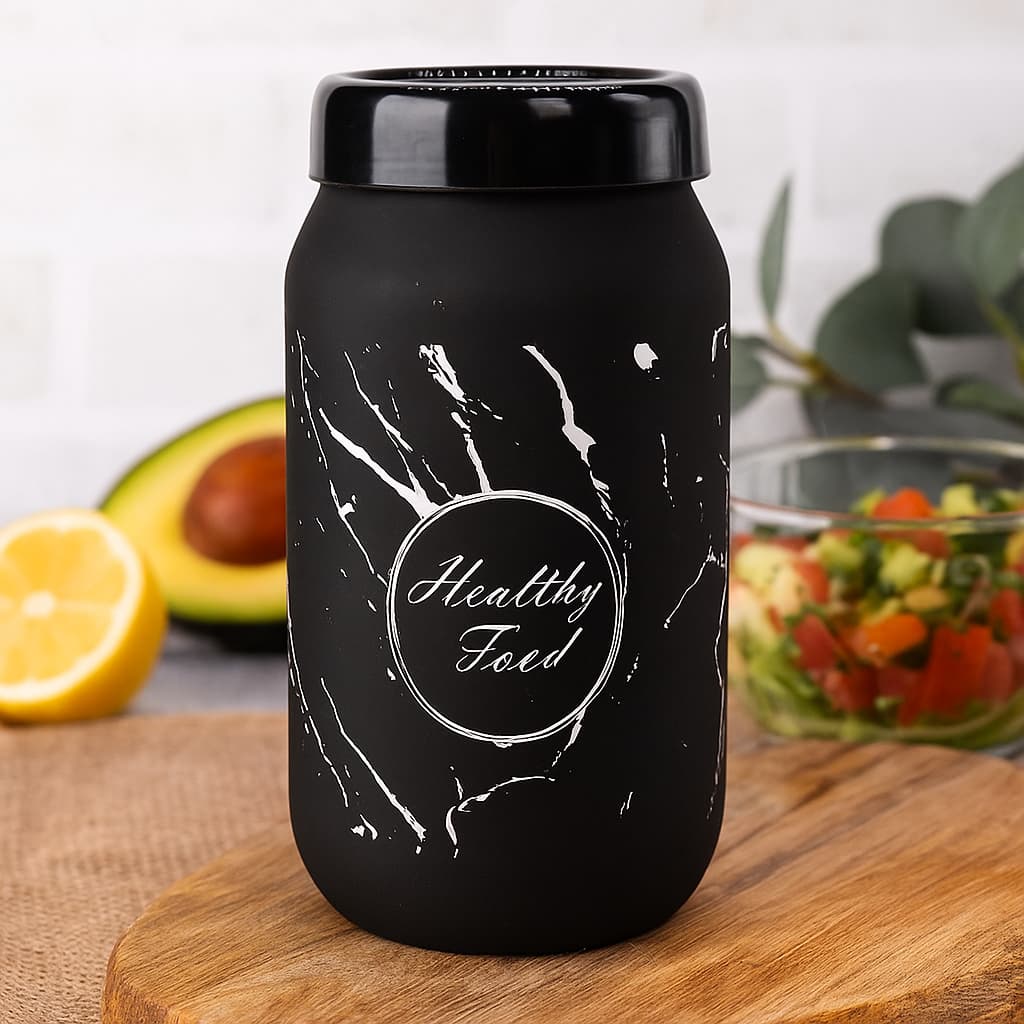Frasco elegante de vidrio negro con diseño mármol y frase “Healthy Food”, ideal para almacenar alimentos secos en la cocina.