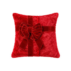 Cojín navideño rojo con lazo decorativo grande