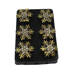 Set de anillos para servilleta dorados con diseño de copo de nieve navideño