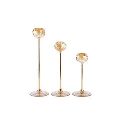 Set de tres candelabros circulares ámbar de diferentes alturas