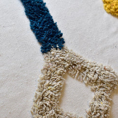 Cojín Rustic 105 multicolor 30×50 cm con diseño geométrico y borlas