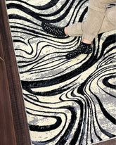 Alfombra rectangular 1.20 × 1.70 m diseño abstracto dorado negro y gris