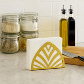 Servilletero triangular dorado acero cromado diseño líneas