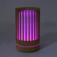 Humidificador cilíndrico de 200ml con acabado en madera y luces LED multicolor.