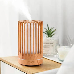 Humidificador cilíndrico de 200ml con acabado en madera y luces LED multicolor.
