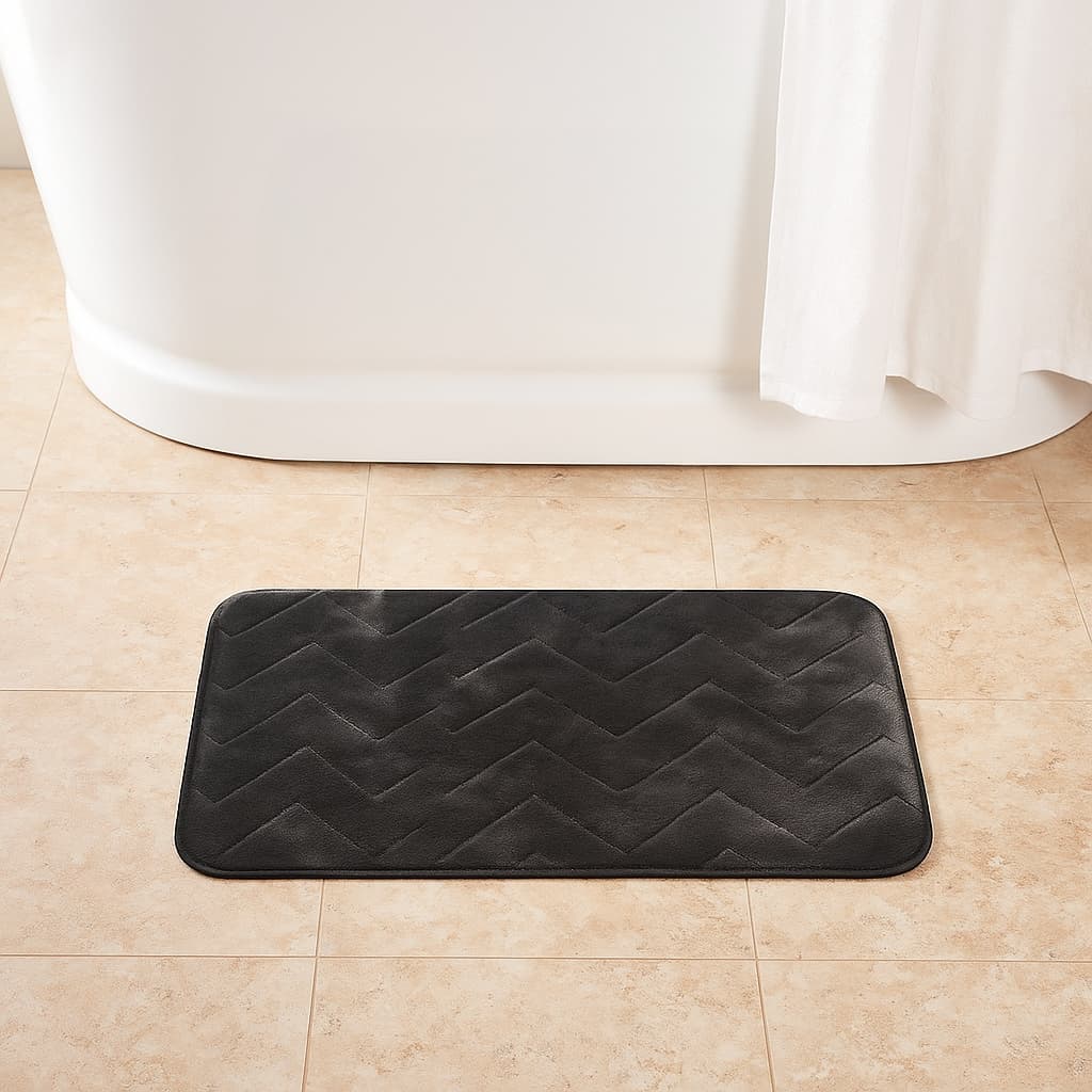 Tapete Memorie 40×60 cm gris oscuro, felpa suave con diseño zig‑zag y base segura.