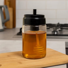 Frasco de vidrio para miel 130ml con tapa negra y aplicador