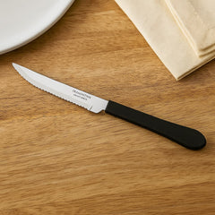 Cuchillo asado de 4 pulgadas Tramontina Leme con hoja dentada y mango negro ergonómico.