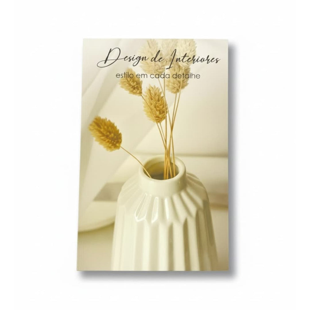 Portada del libro "Anova Era Da" sobre mesa de diseño