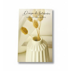 Portada del libro "Anova Era Da" sobre mesa de diseño