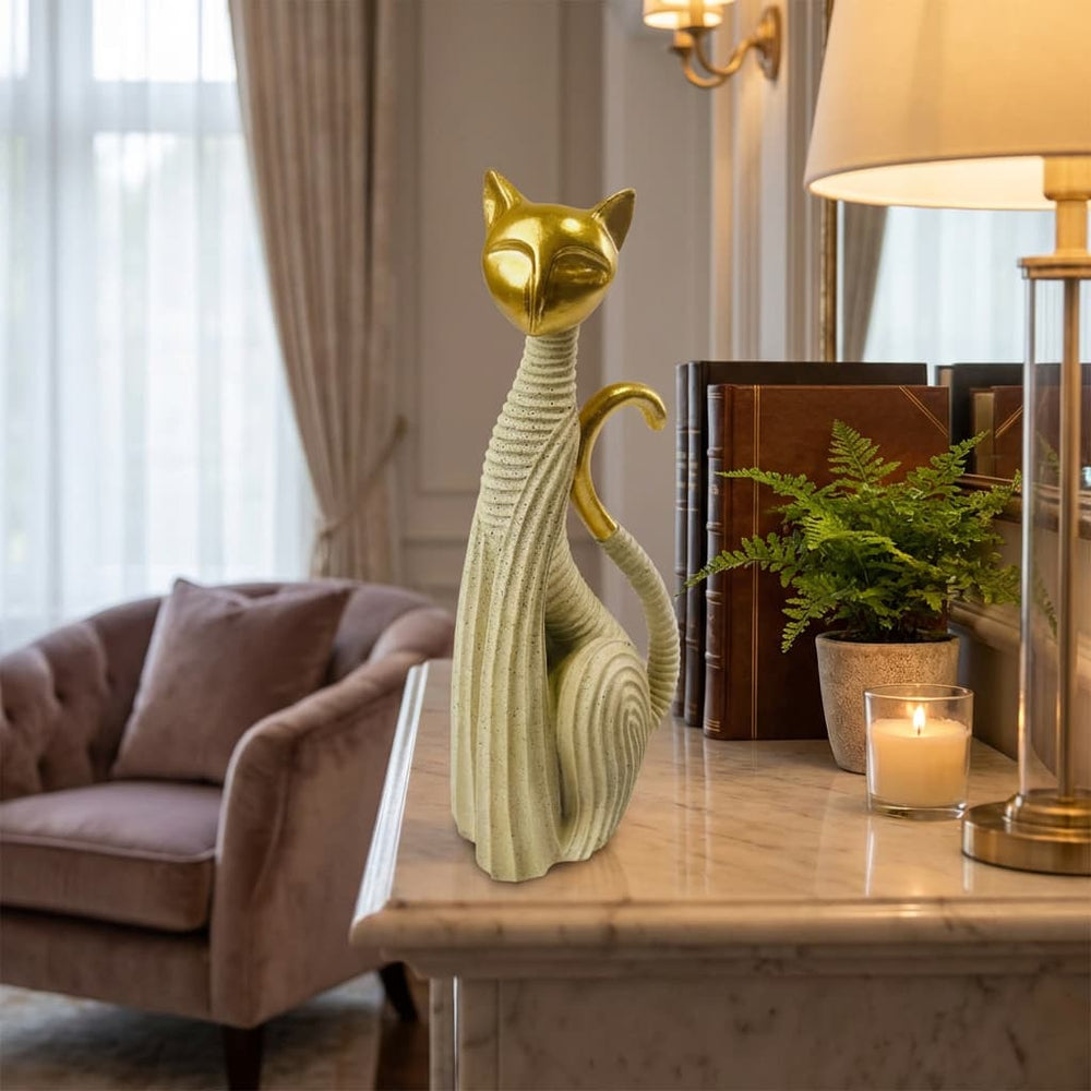 Figura decorativa gato estilizado beige con cabeza dorada