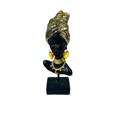 Figura decorativa africana con turbante dorado
