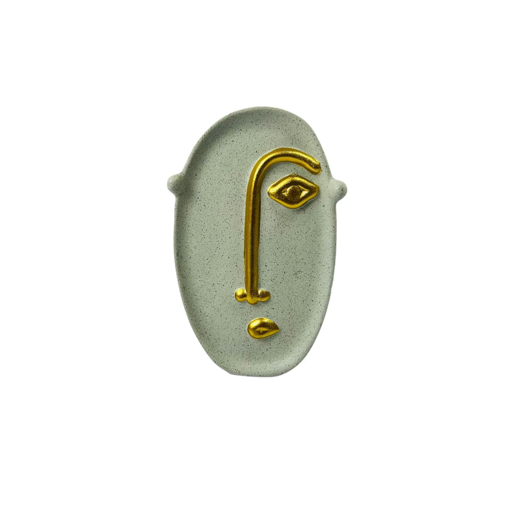 Figura rostro artístico beige con dorado
