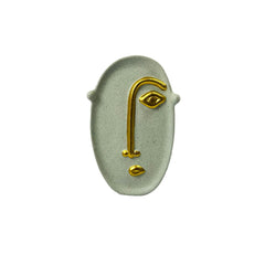 Figura rostro artístico beige con dorado