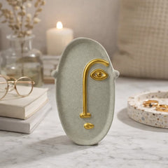 Figura decorativa rostro abstracto beige con detalle dorado