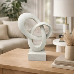 Escultura decorativa abstracta blanca entrelazada con base dorada