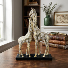 Pareja de jirafas decorativas doradas 42×17 cm con relieve y base negra