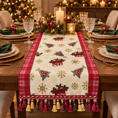 Camino de mesa navideño beige con rojo, diseño festivo y borlas decorativas.