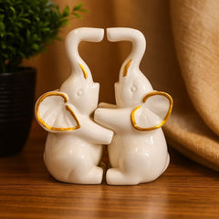 Elefantes decorativos en cerámica blanco con dorado set x2 16x7 cm