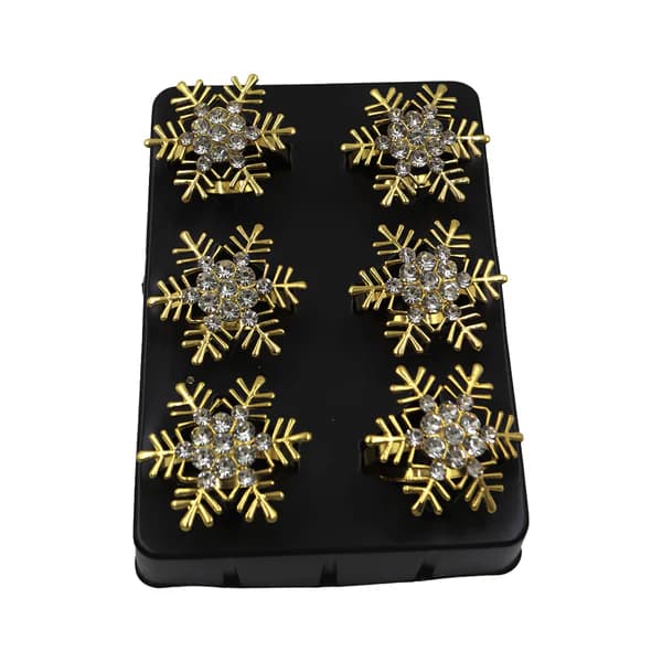 Set de anillos para servilleta dorados con diseño de copo de nieve navideño