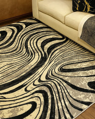 Vista superior de alfombra decorativa abstracta negro gris con detalles dorados