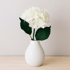 Hortensia decorativa artificial blanca con hojas verdes de 64cm de alto