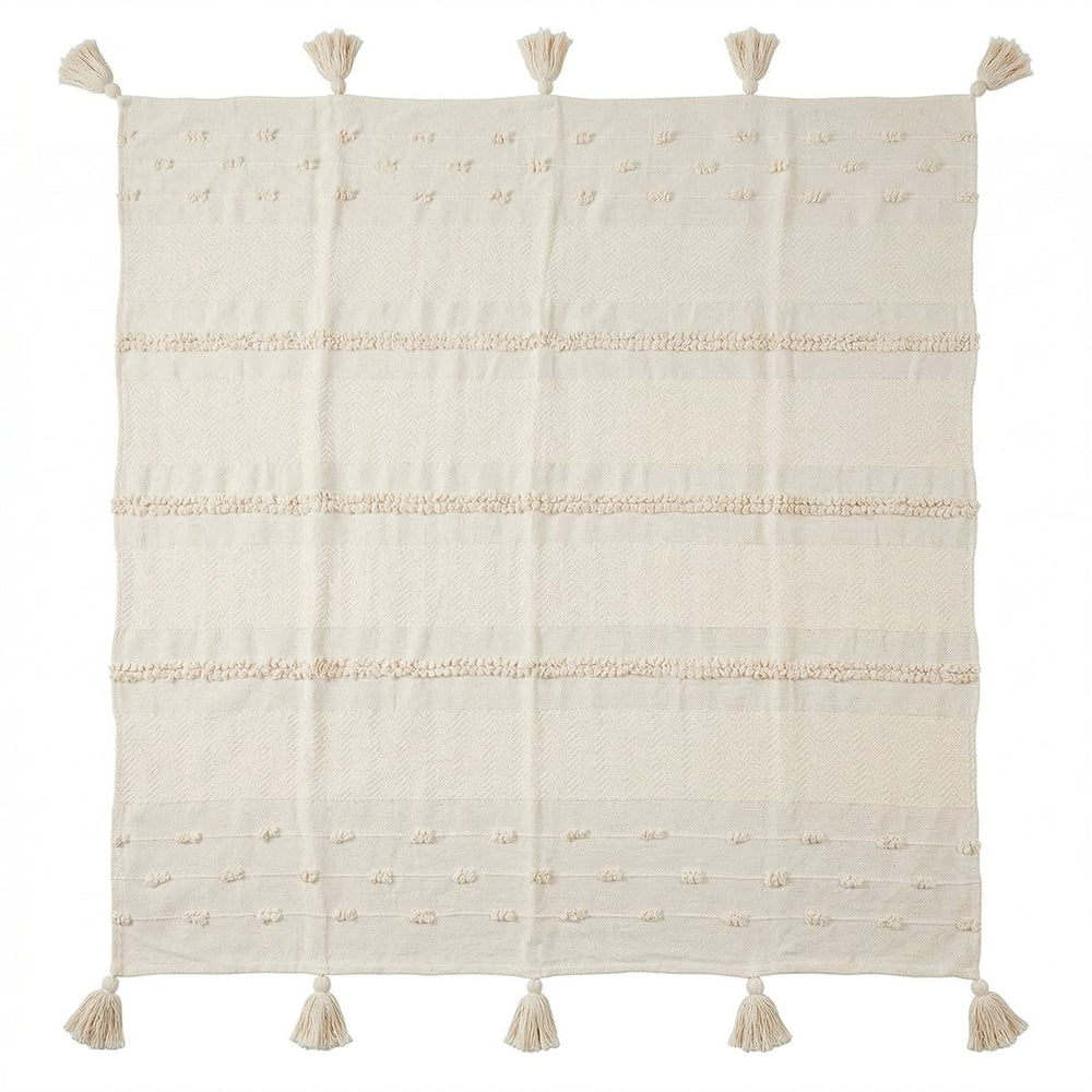Frazada boho con relieves y borlas decorativas

