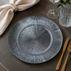 Plato base decorativo de melamina plateado 33 cm con diseño destello radial
