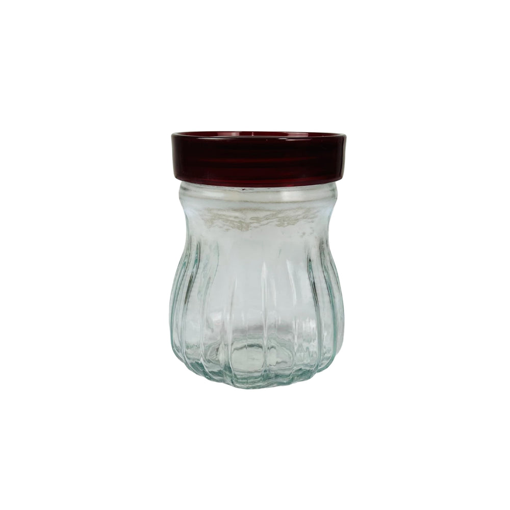 Frasco de vidrio con tapa roja para cocina