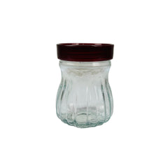 Frasco de vidrio con tapa roja para cocina