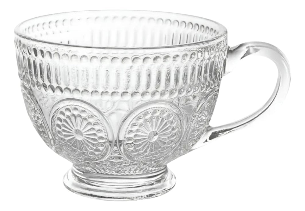 Taza de vidrio con patrones decorativos circulares