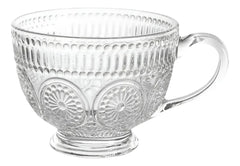 Taza de vidrio con patrones decorativos circulares