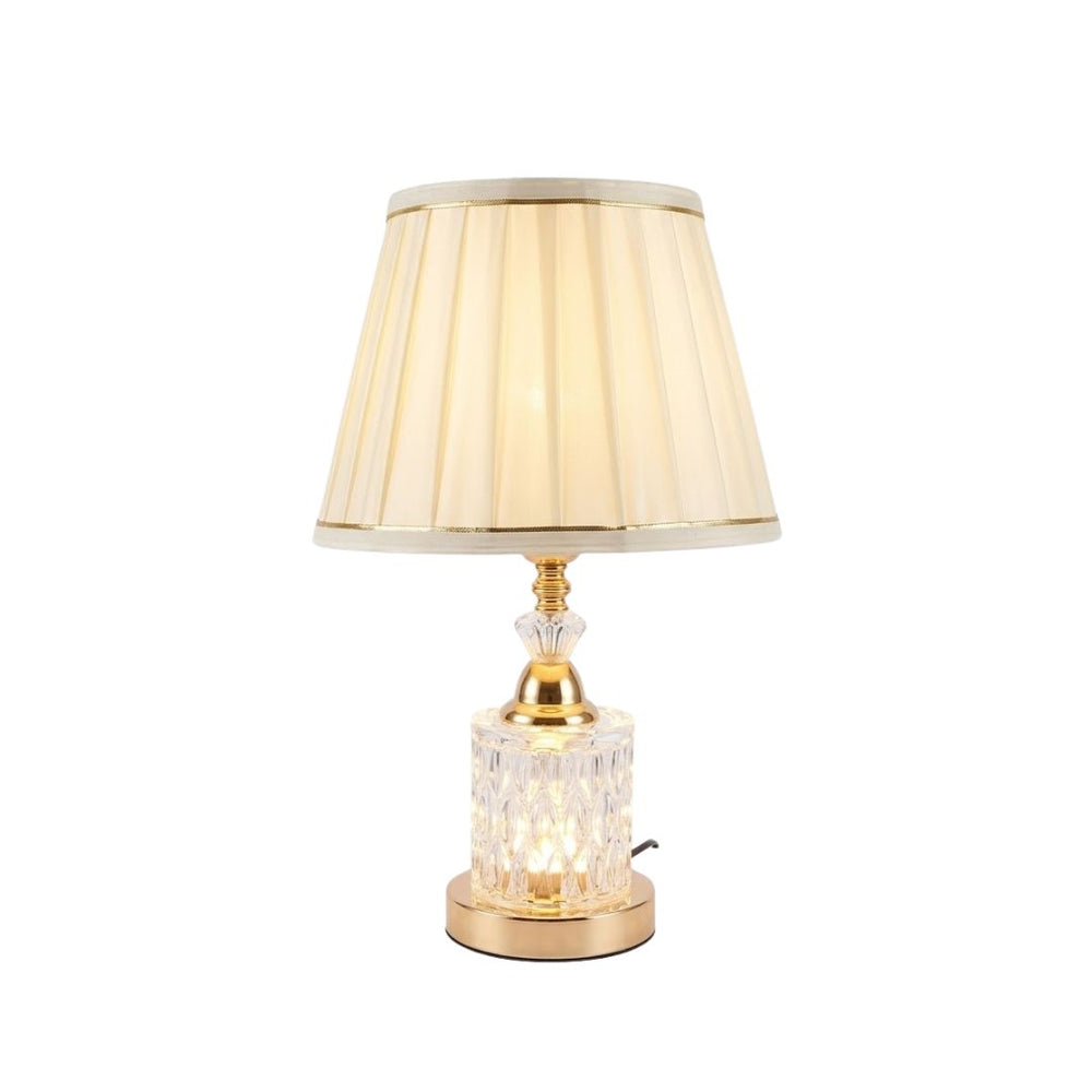 Lámpara de mesa con base de cristal tallado y acabado dorado