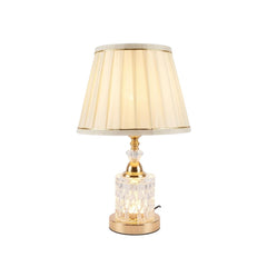 Lámpara de mesa con base de cristal tallado y acabado dorado